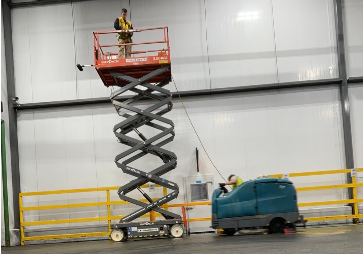 Gleaming epoxy warehouse floor with aisle markings